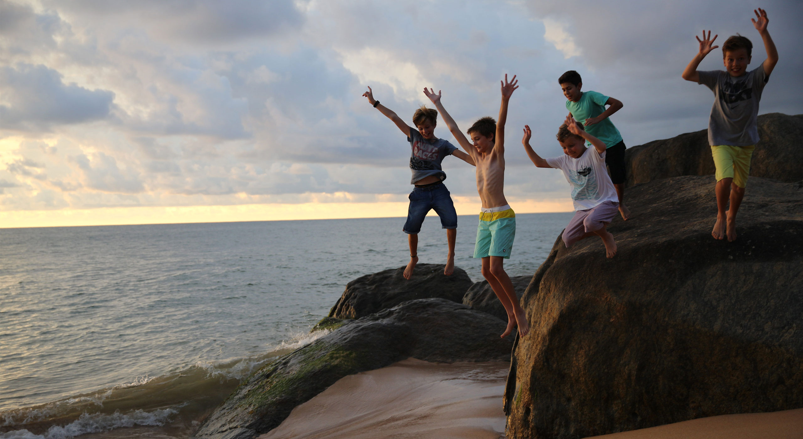 Siblings having fun on the beach