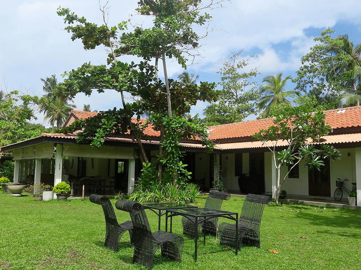 garden with metal chairs and tables