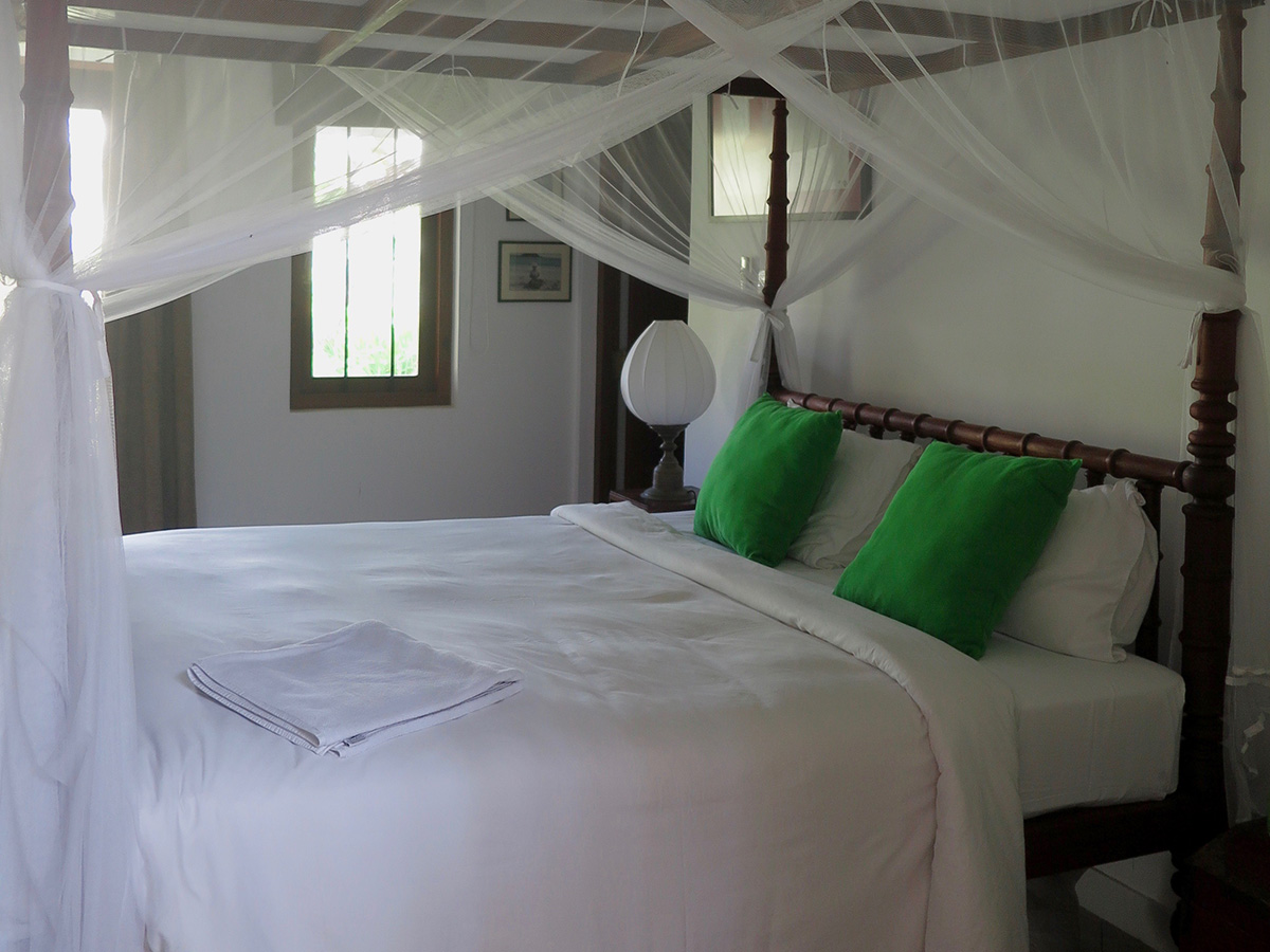 Big antique bed inside room