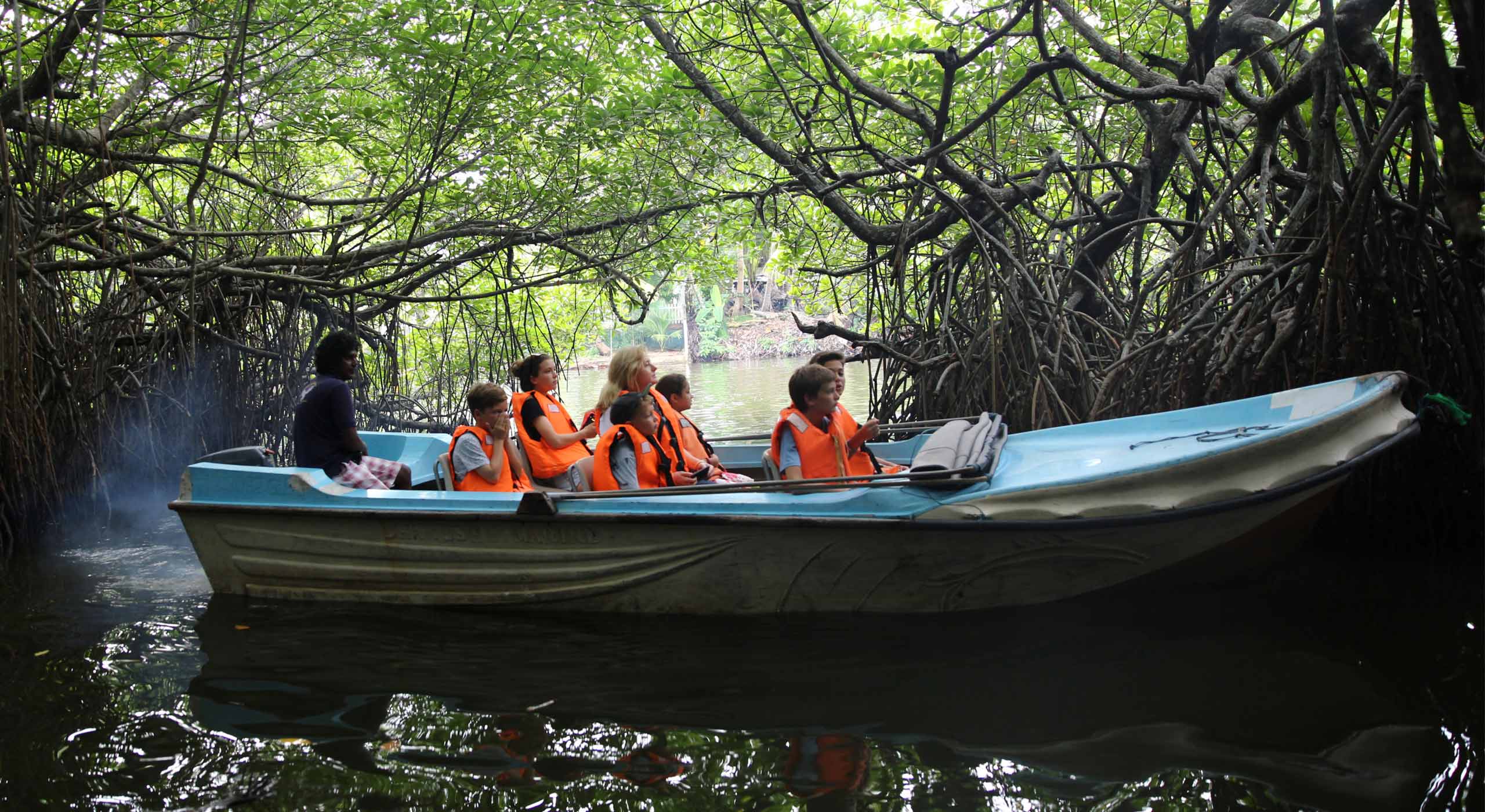 people on a boat exploring the beauty of the River